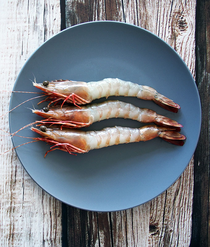 How to stop prawns curling when cooking