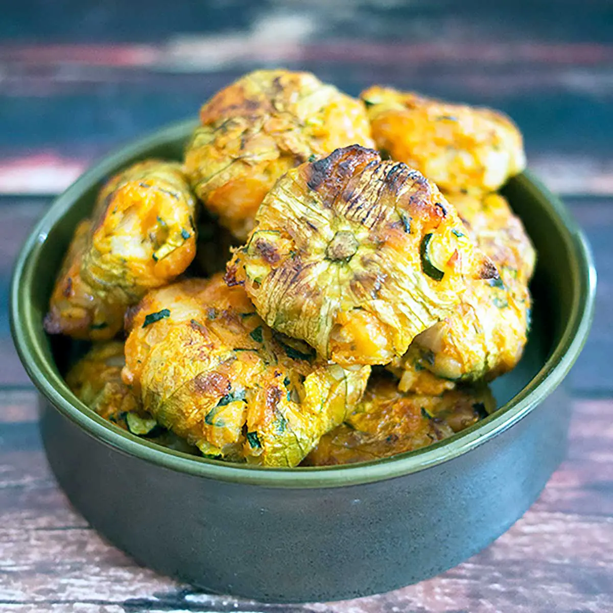 baked zucchini fritters in a bowl