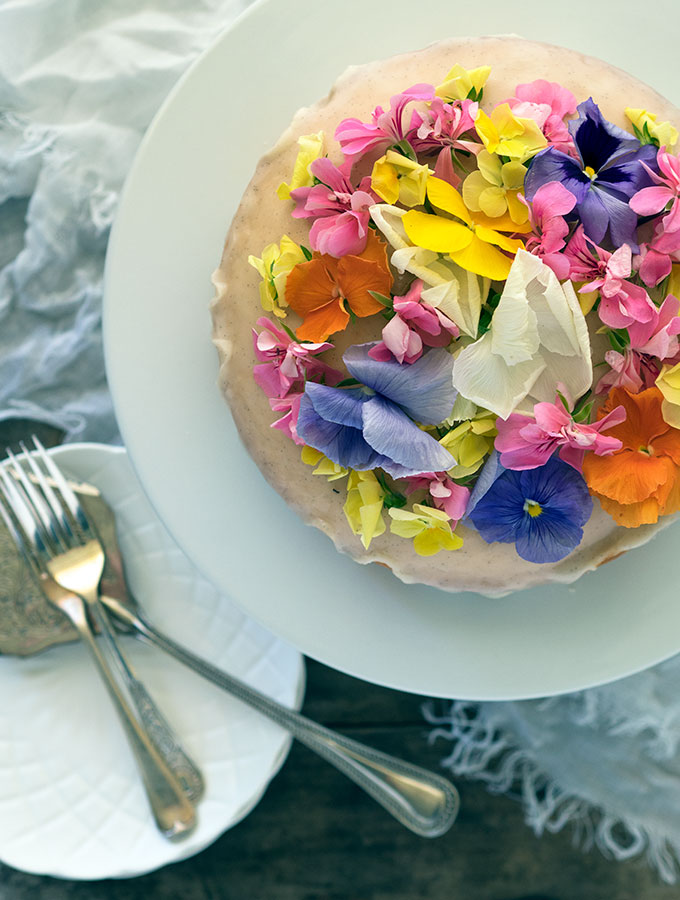 Brandy Butter Cake decorated with vanilla brandy icing and edible flowers