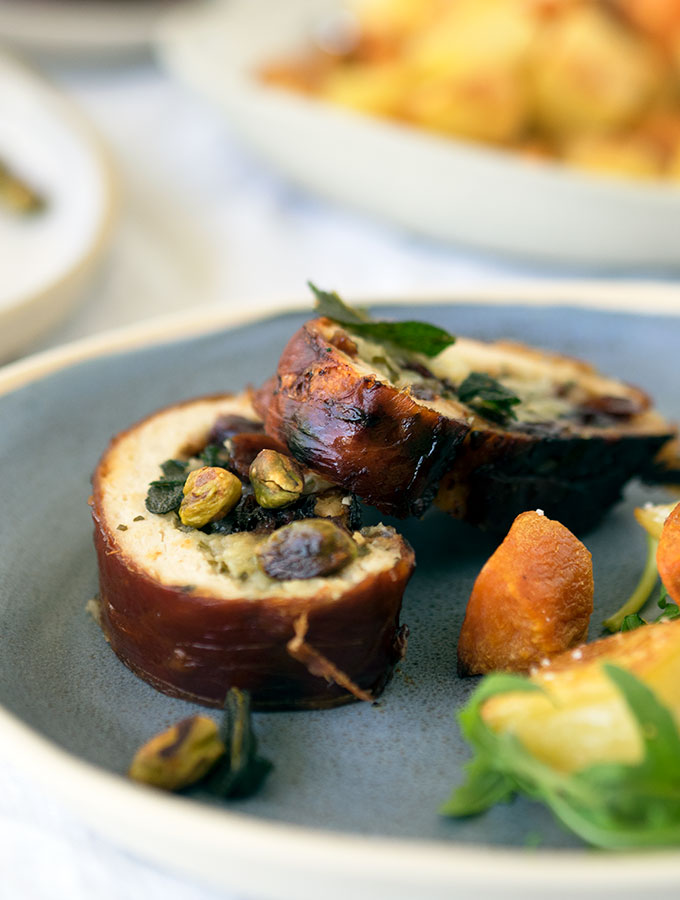 Turkey Roulade stuffed with apple, cranberries and sage, wrapped in prosciutto