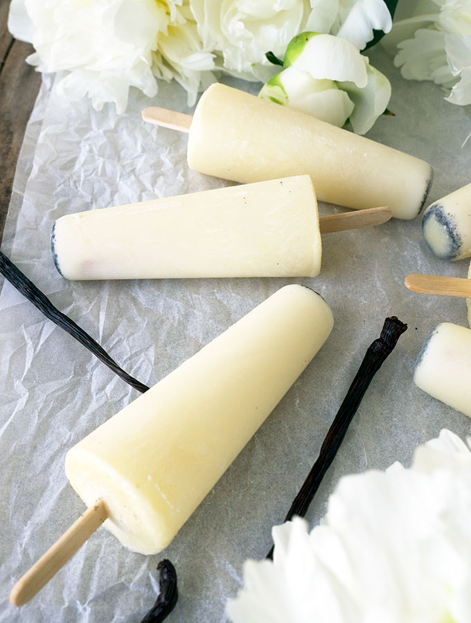 Vanilla Milk Ices are the lighter, easier alternative to making ice cream popsicles. Only three ingredients, no churning required and they are egg free.