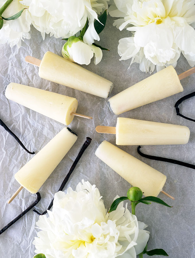 Vanilla Milk Ices are the lighter, easier alternative to making ice cream popsicles. Only three ingredients, no churning required and they are egg free.