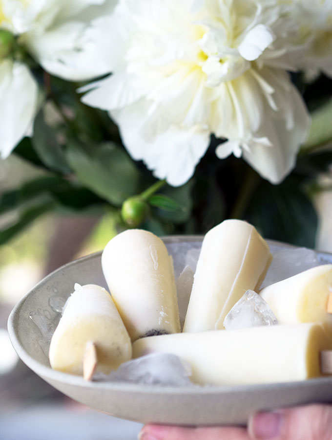 Vanilla Milk Ices are the lighter, easier alternative to making ice cream popsicles. Only three ingredients, no churning required and they are egg free.