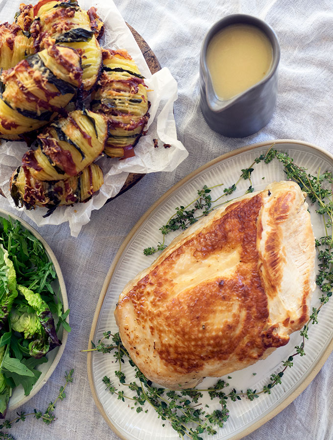 Poached Turkey Breast with Easy Gravy is the perfect recipe for Christmas entertaining. Especially if you are short on time and oven space, the turkey will be on the table in 50 minutes. Poaching aids keeping the breast succulent and tender. 