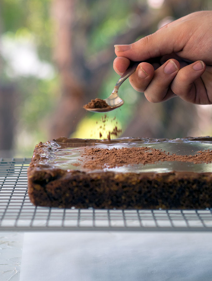 Sprinkling Milo on this super easy Milo slice.