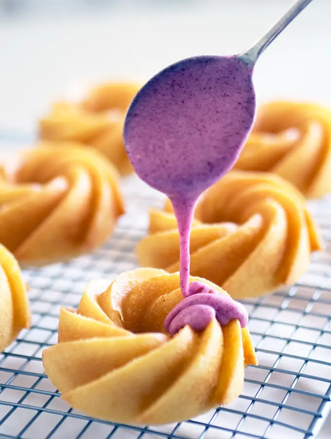 Simple Melt and Mix Vanilla Cakes covered with freeze dried plum icing