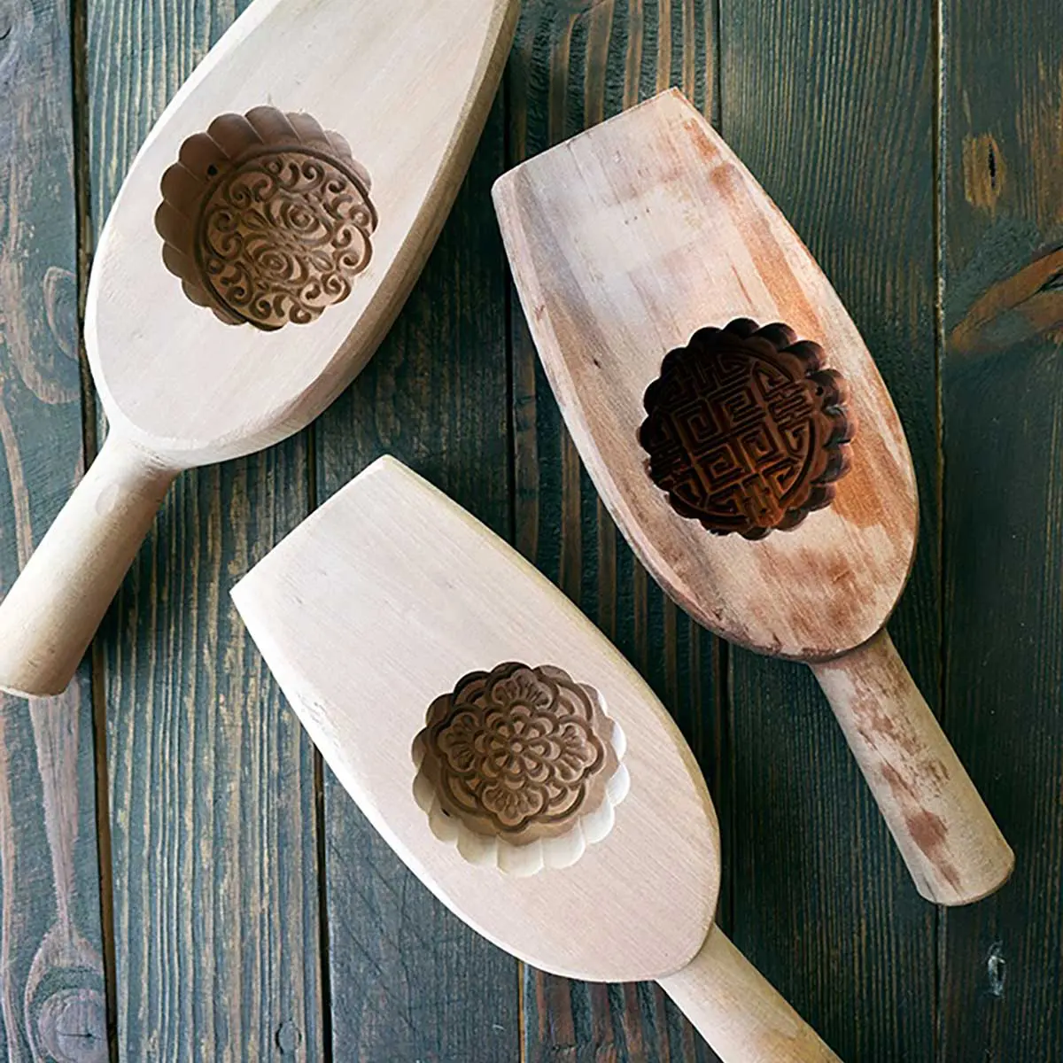 moon cake moulds on a wooded board