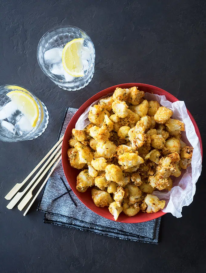 Oven Baked Popcorn Cauliflower made simply with breadcrumbs, parmesan cheese, thyme and smoked paprika