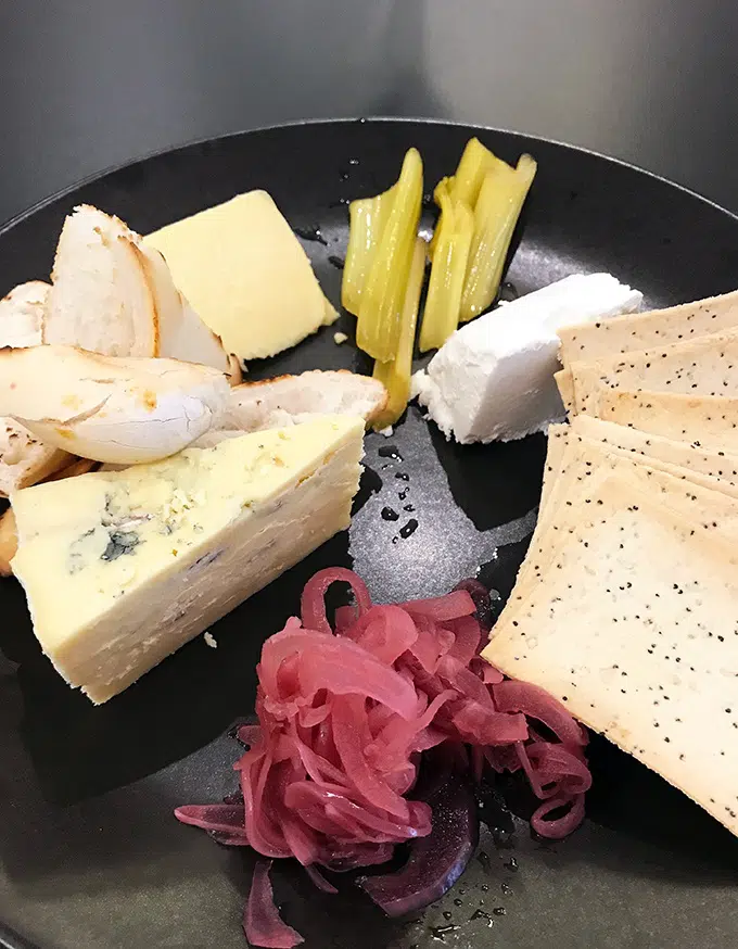 Cheese platter with amazing pickled celery, the best pickled vegetable in the world