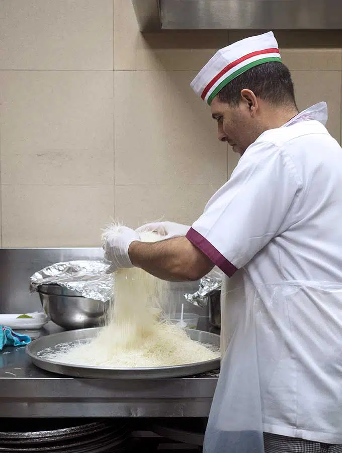 Chef preparing Kanafeh noodles