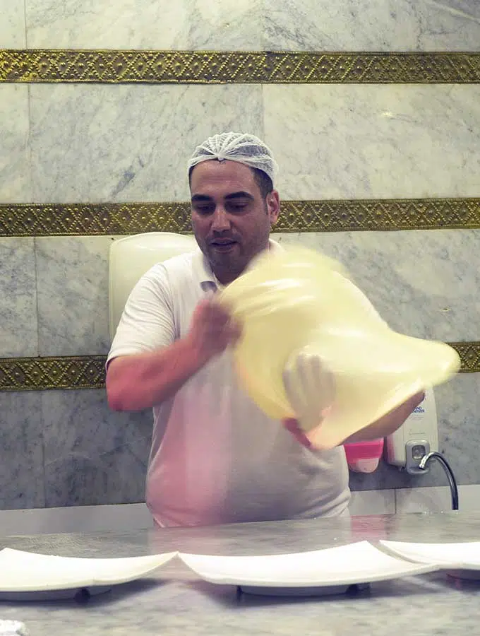 Chef tossing pastry for Egyptian Feteer in Dubai