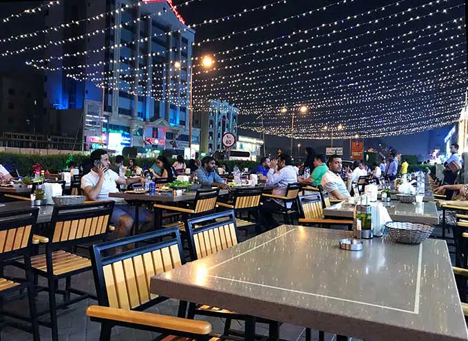 Fairy lights decorating outdoor seating at a Dubai Restaurant