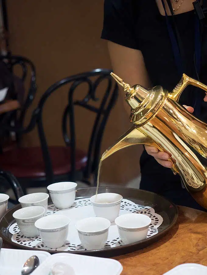 Pouring Arabic Coffee from a traditional Coffee Pot in Dubai