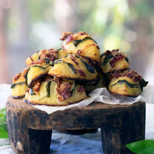 easy crispy hasselback potatoes stuffed with prosciutto and basil