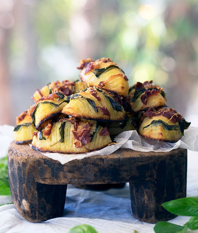 easy crispy hasselback potatoes stuffed with prosciutto and basil