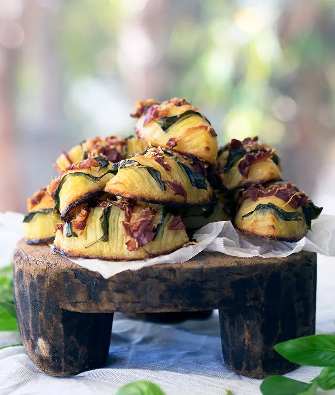 easy crispy hasselback potatoes stuffed with prosciutto and basil
