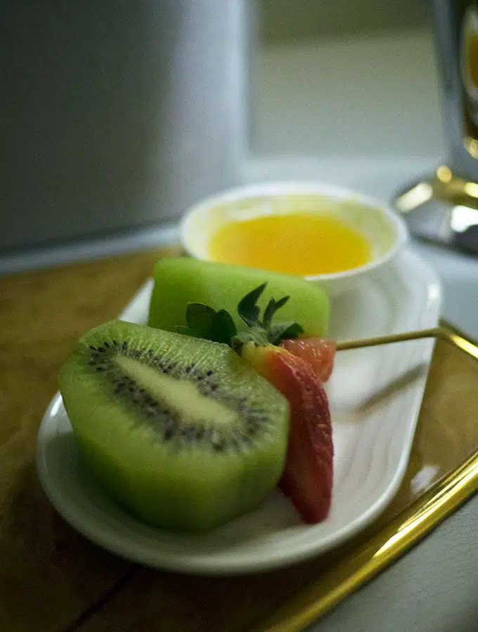 Emirates First Class Sydney to Bangkok post shower fruit plate