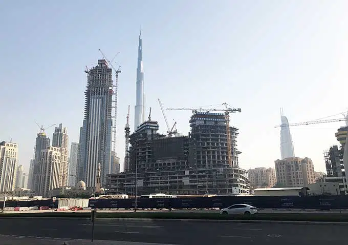 view of construction in dubai with burj khalifa in the back ground