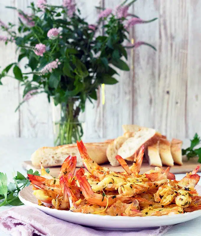 Prawns Saffron and Almond Goats Butter on a large white platter