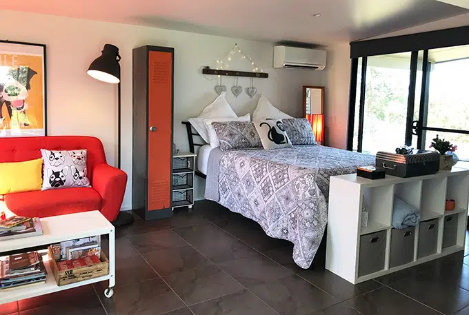 double bed in open plan room at the dog house port macquarie