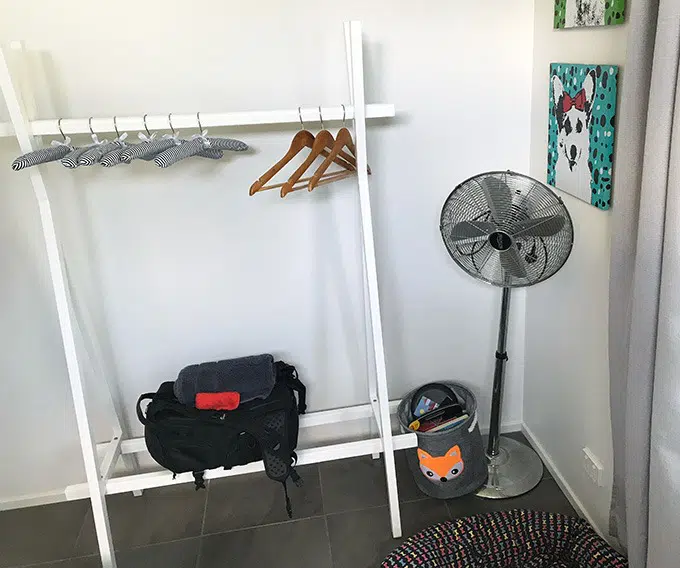 clothes hanging area, fan and rack in second bedroom at the dog house port macquarie