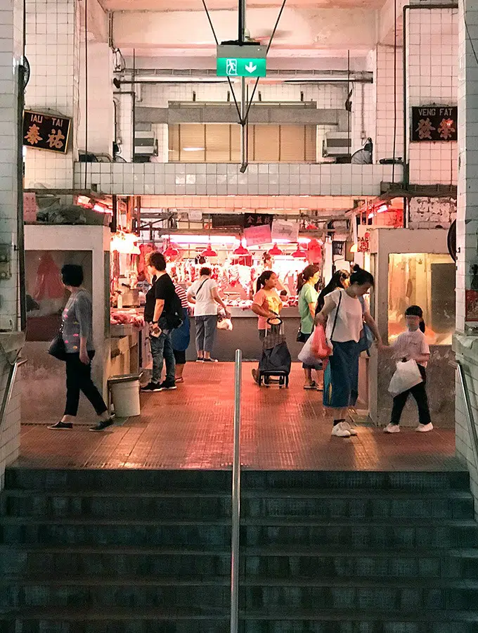 people walking around level three of the red market macao