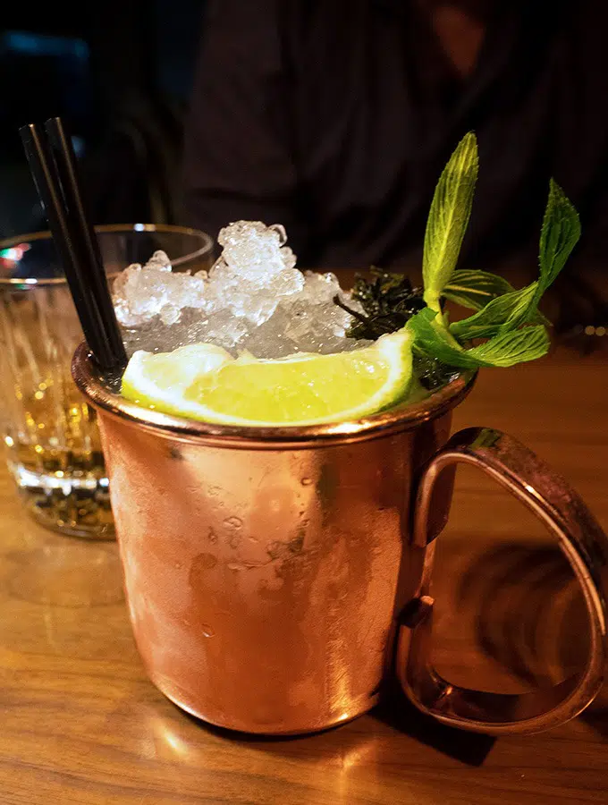 copper tankard with crushed ice, slice of lime and mint