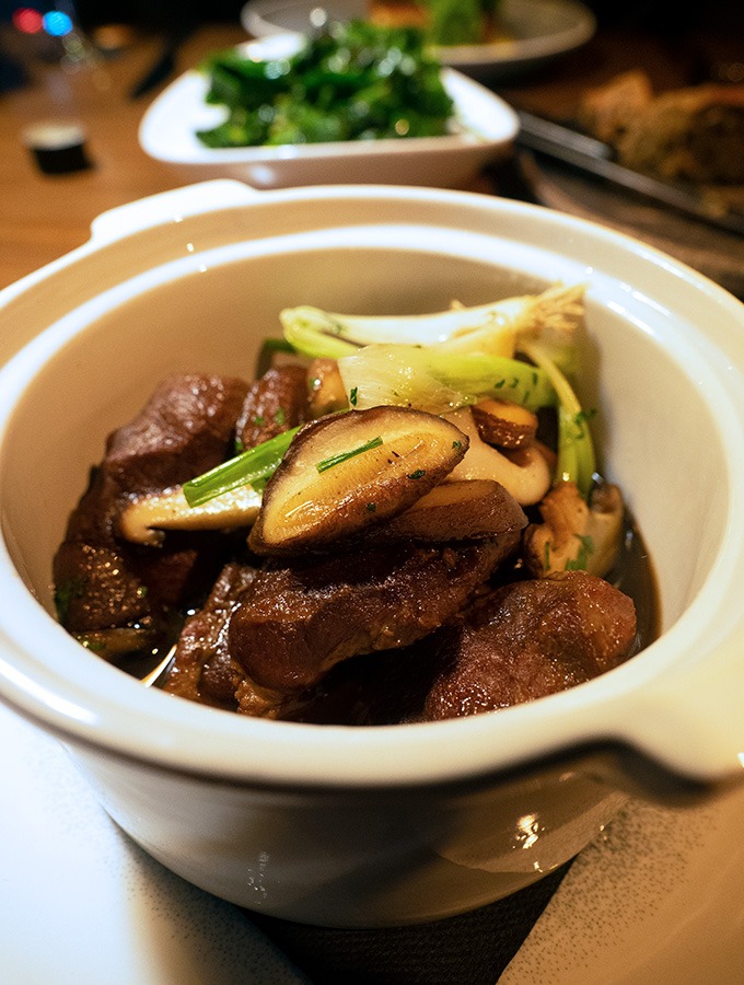 bowl with pork cheeks and mushrooms