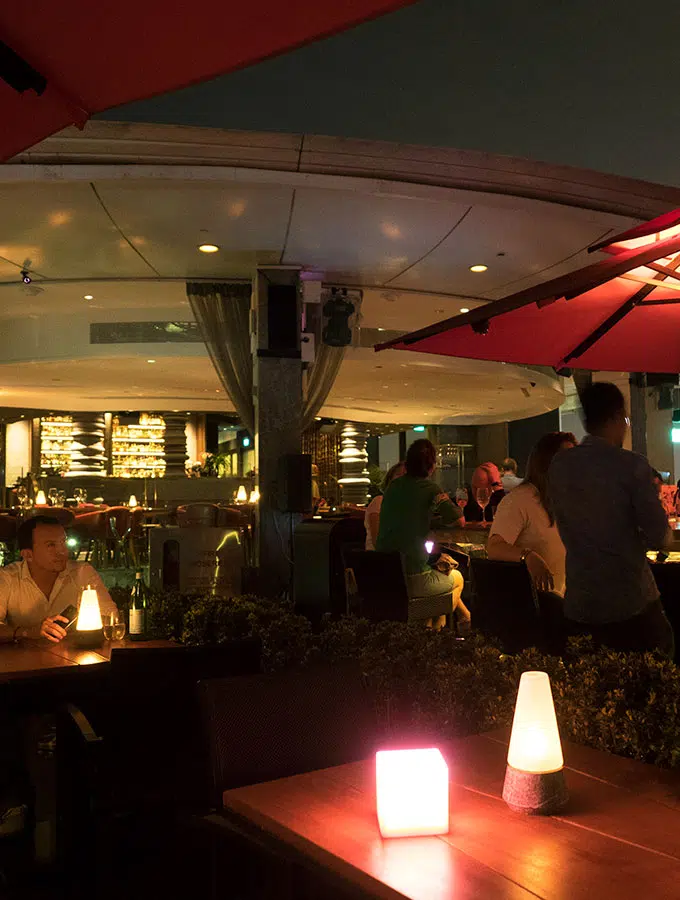 table with lamps at night in an restaurant - Ce La Vi Singapore