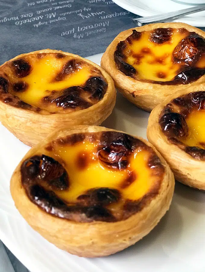 egg tarts on a white plate