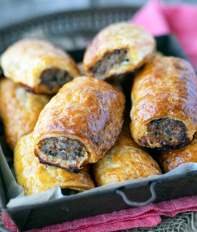 sausage rolls in a metal tray