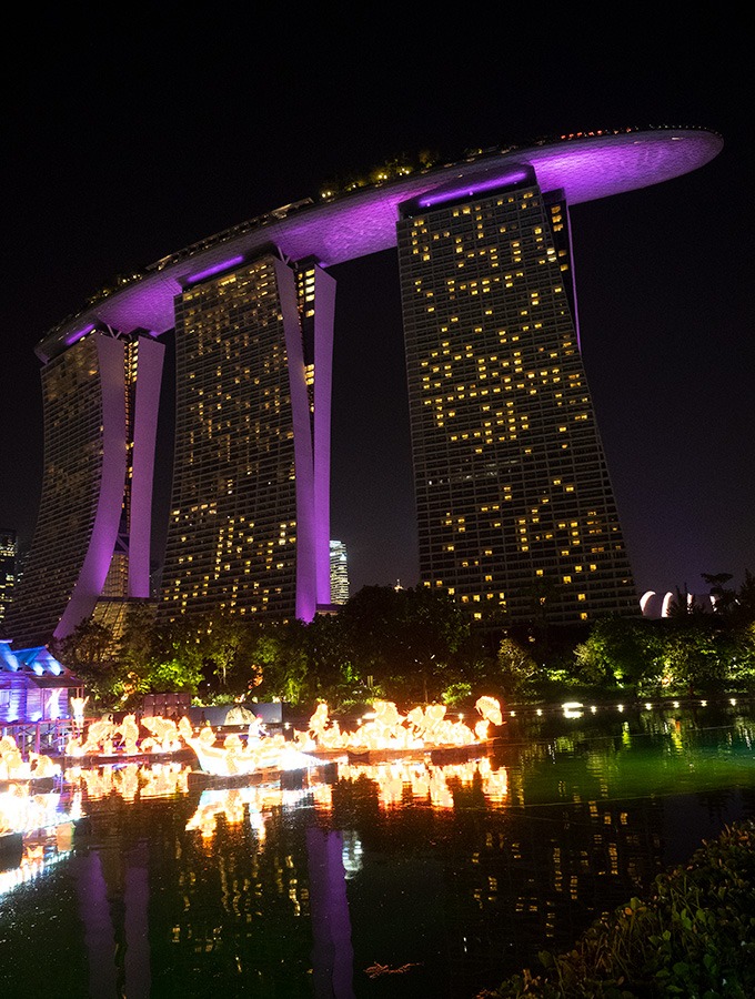 marina bay sands lit up at night the three towers glowing pink