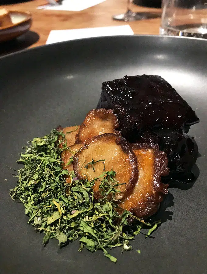 wagyu topside with mushrooms and dried kale on a plate at bangalay dining