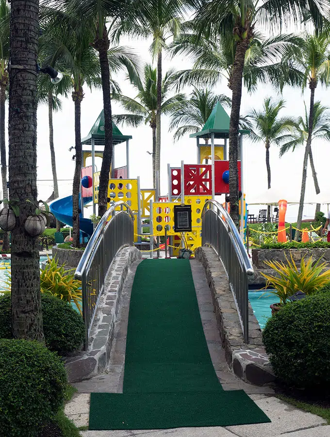 bridge over a pool to the kids play equipment