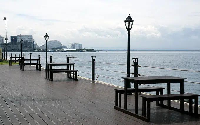 lamps and tables near the water at Sofitel Philippine Plaza Manila