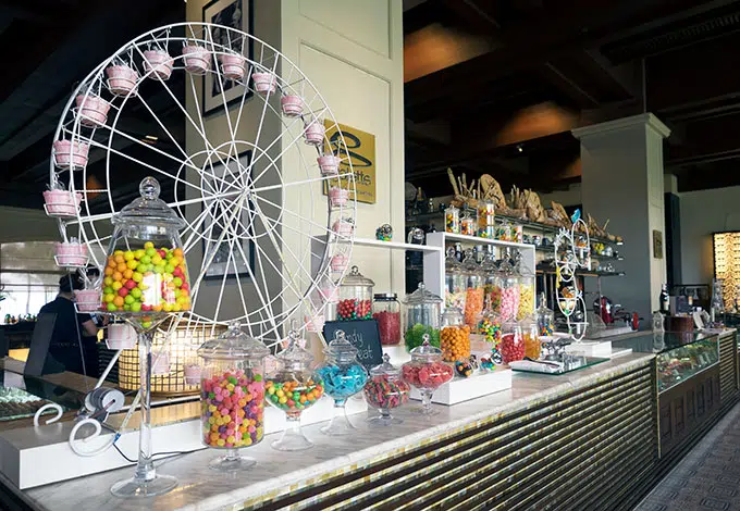 candy bar with various candy and a ferris wheel