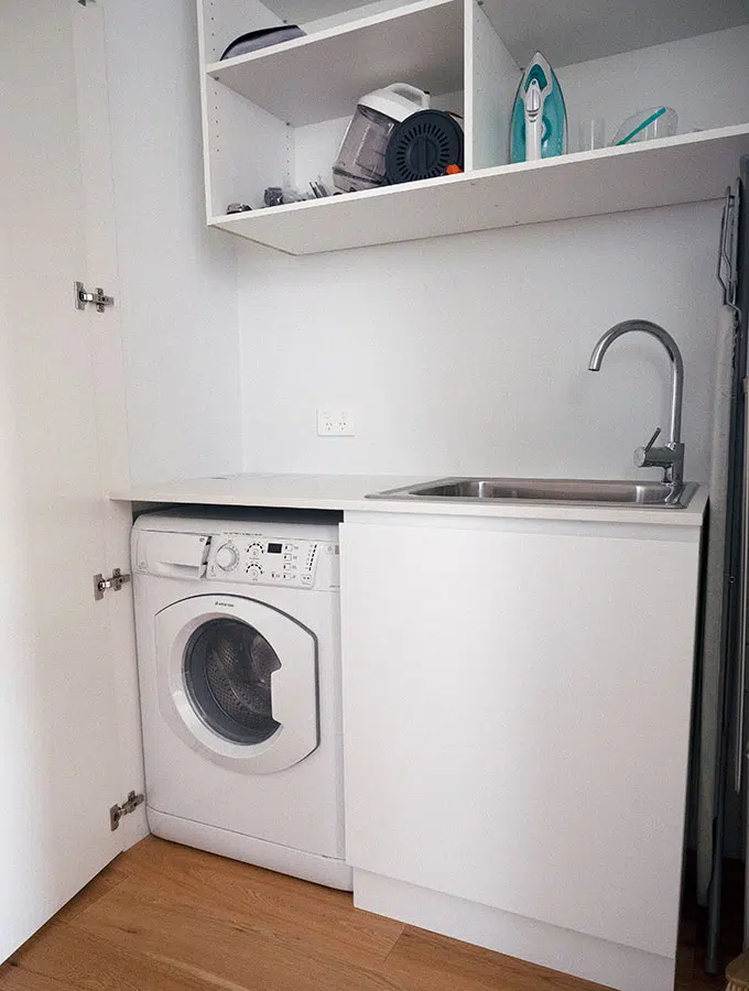 washing machine and sink in the laundry cupboard