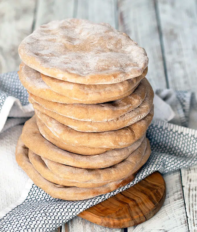 spelt pita pockets stacked on top of one another