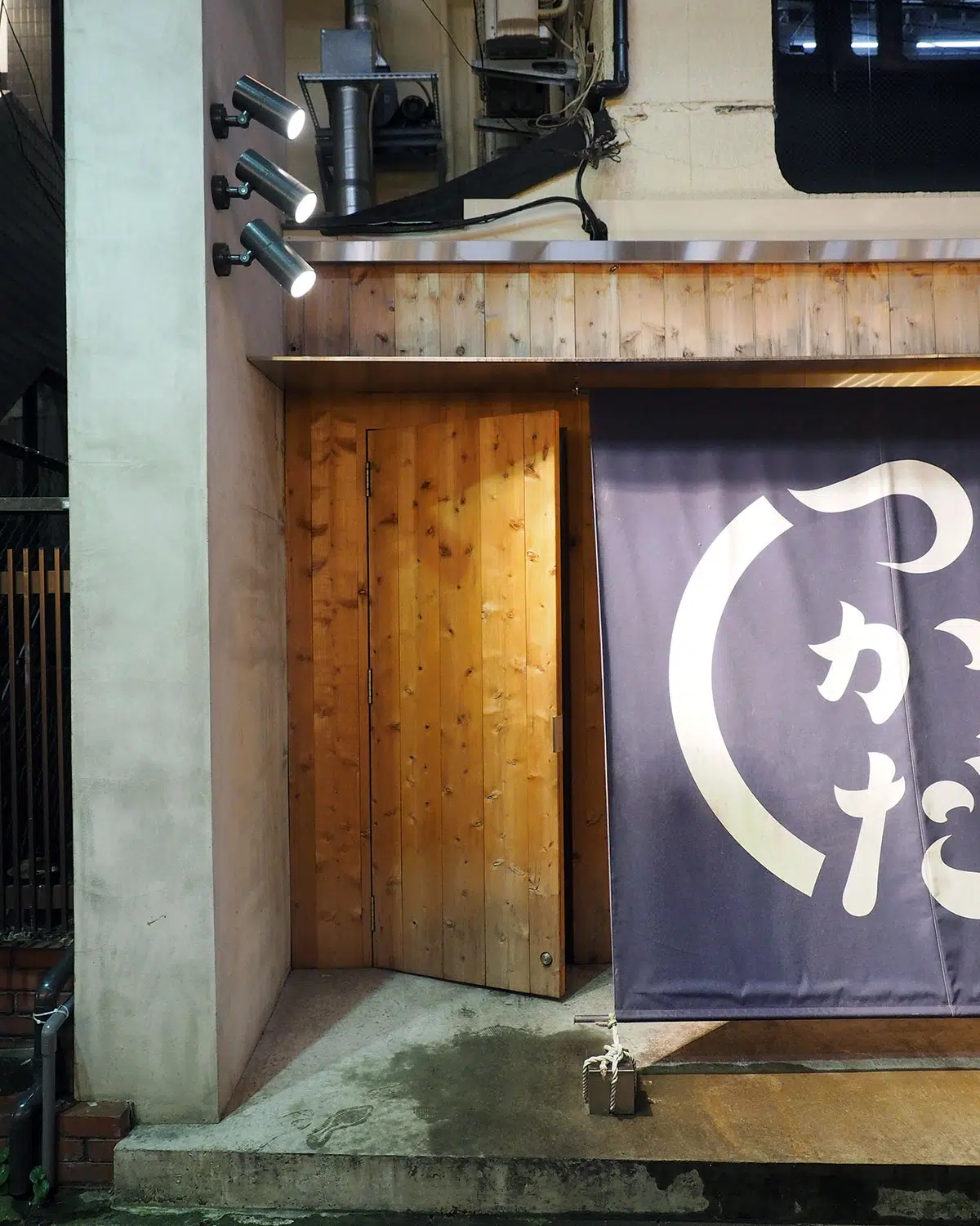 wooden door leading to the secret sake speakeasy