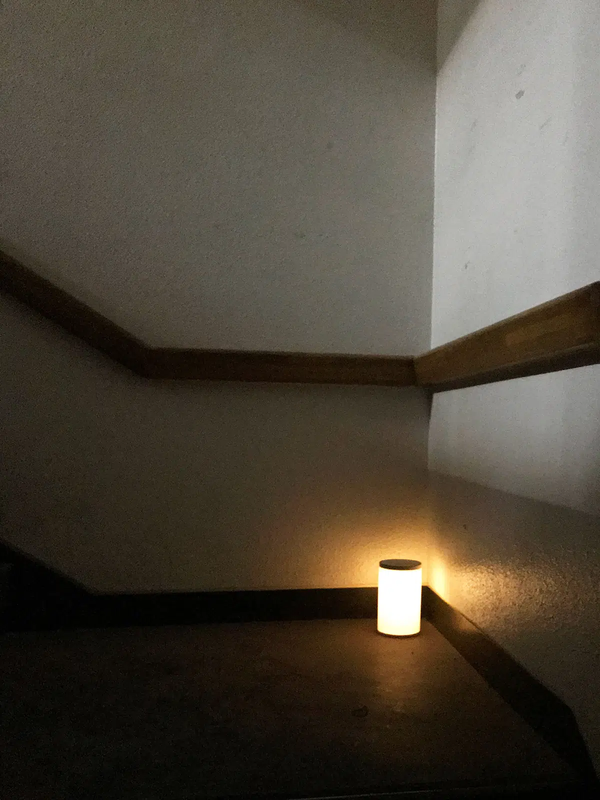 candle on a stair case landing