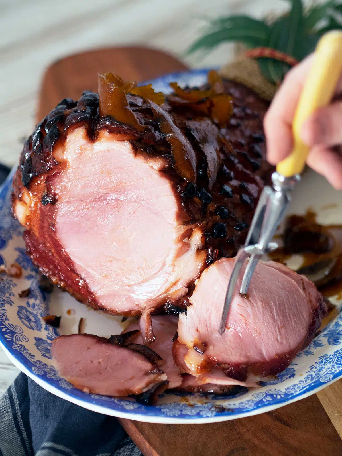 rum and coca cola glazed ham being sliced