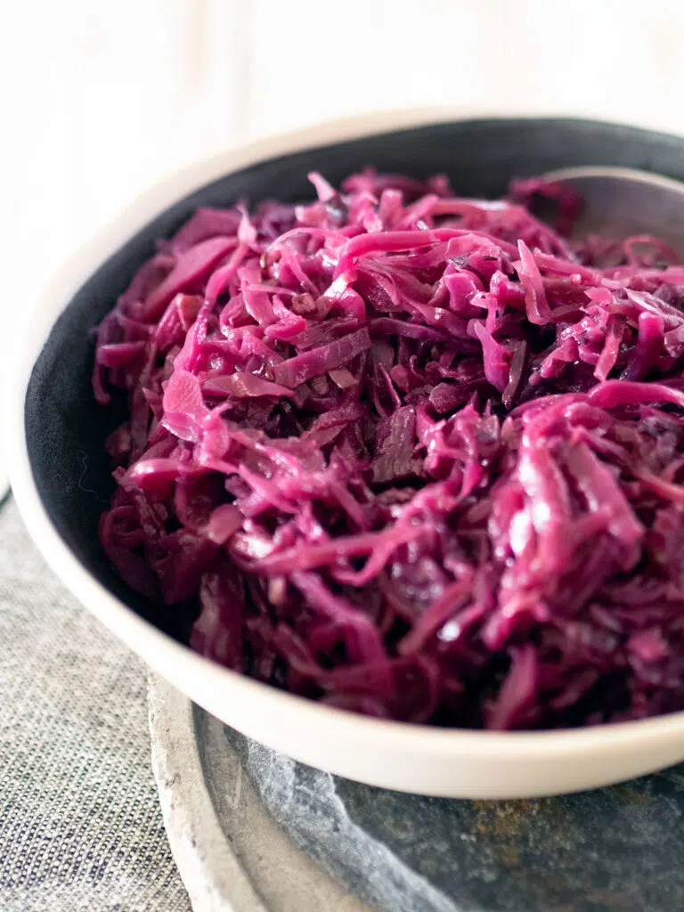 close up of red cabbage in a serving bowl to show texture