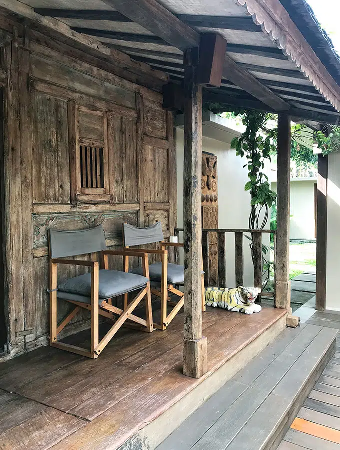 deck in front of cabin with chairs