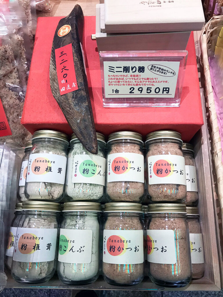 various bonito products in glass jars with a piece of dried bonito