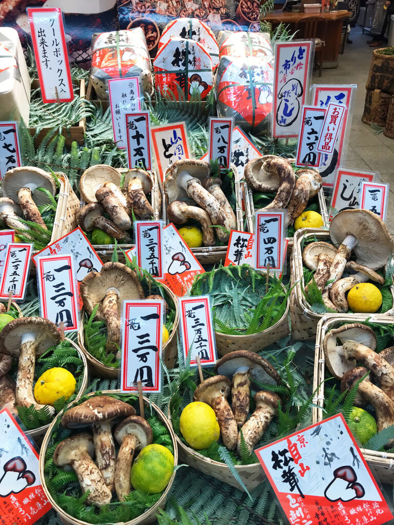 various grades of king mushrooms in baskets for sale