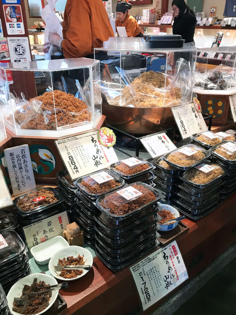 marinated tiny fish in containers ready to buy at nishiki markets