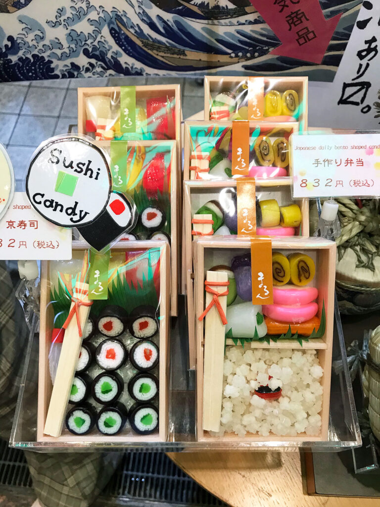 candy made to look like various forms of sushi in wooded boxes