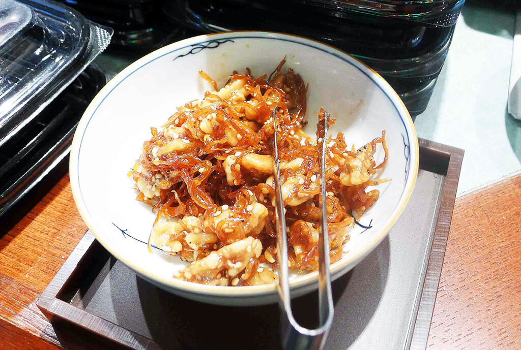 candy walnuts and shirauo in a bowl for people to sample