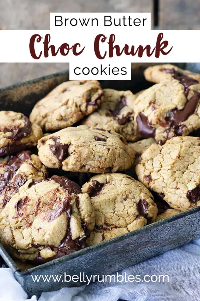 chocolate chunk cookies piled up in an embossed baking tray