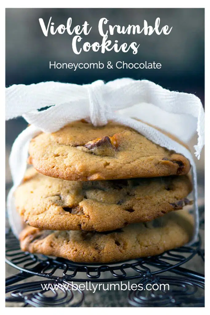 three cookies tied up with ribbon on a cooling rack